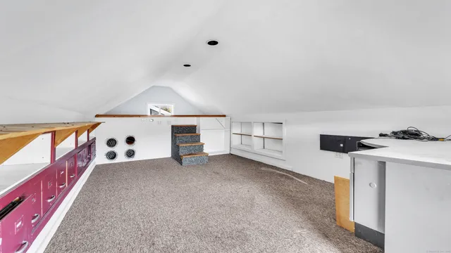 a view of an empty room with windows