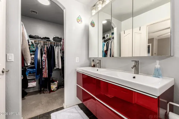 a view of a bathroom with a sink and mirror