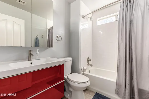 a bathroom with a sink a toilet and a bathtub