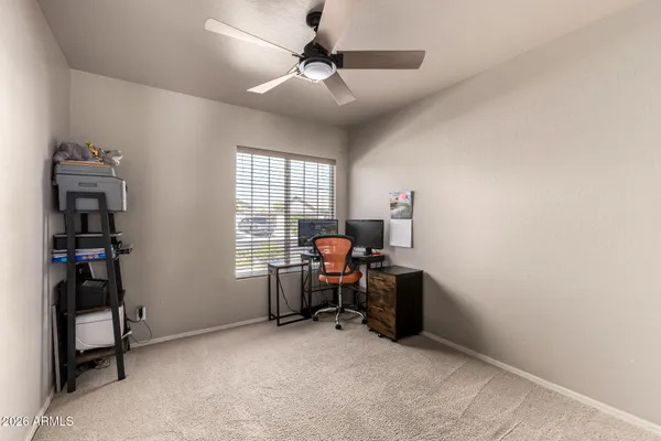a view of workspace with furniture and window