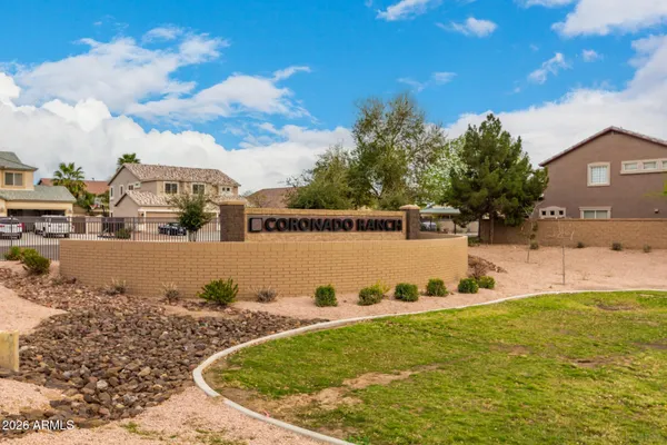 a view of a swimming pool with outdoor seating