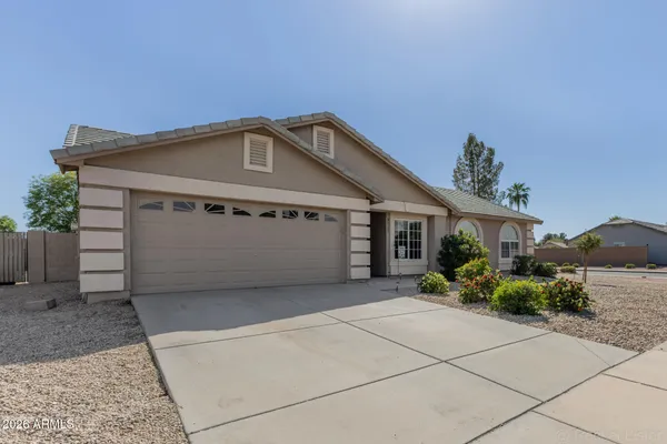 a front view of a house with a garage
