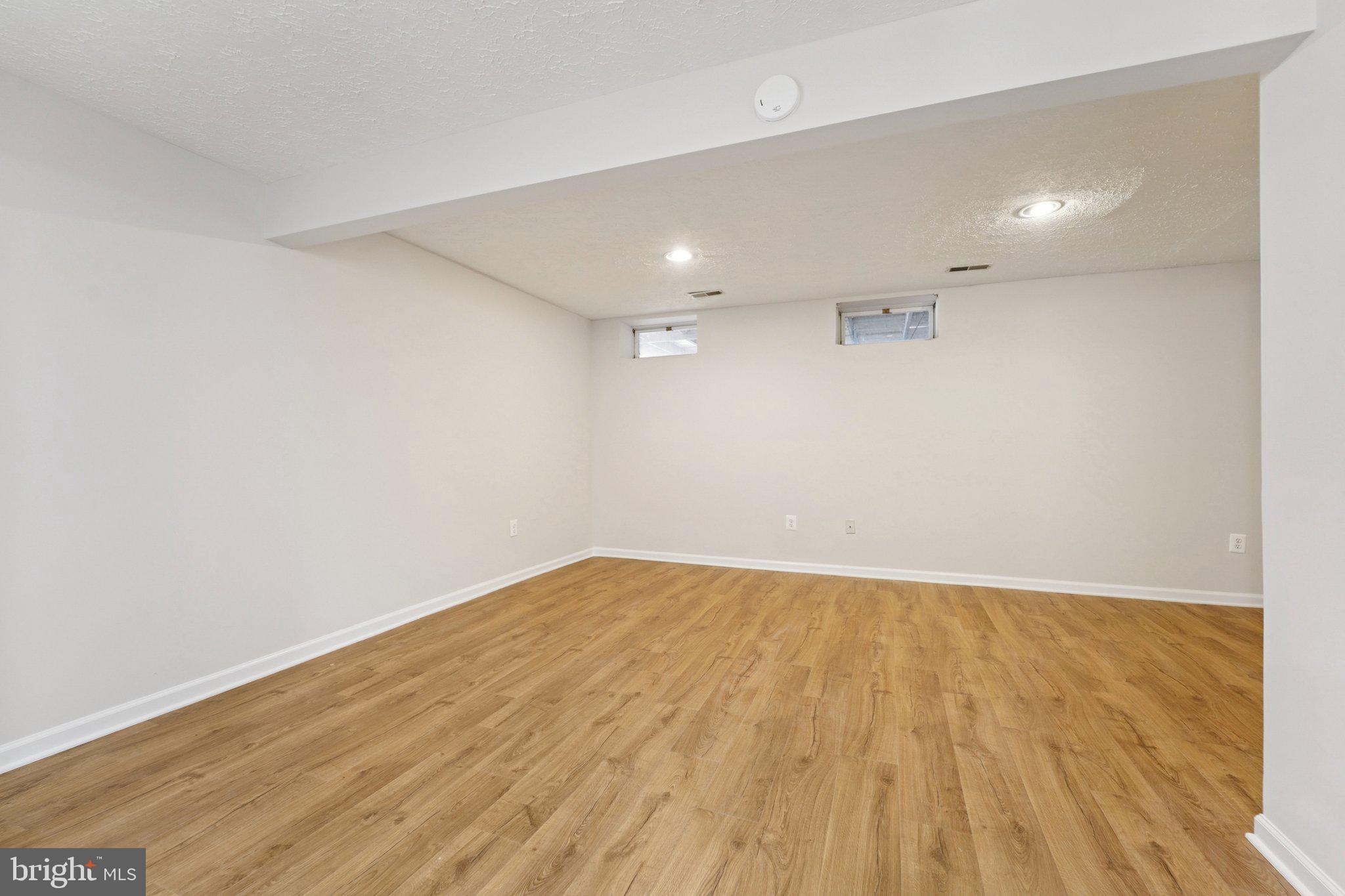 8727 Silver Hall Road Perry Hall, MD 21128 - Photo 19 of 35 a view of an empty room with wooden floor