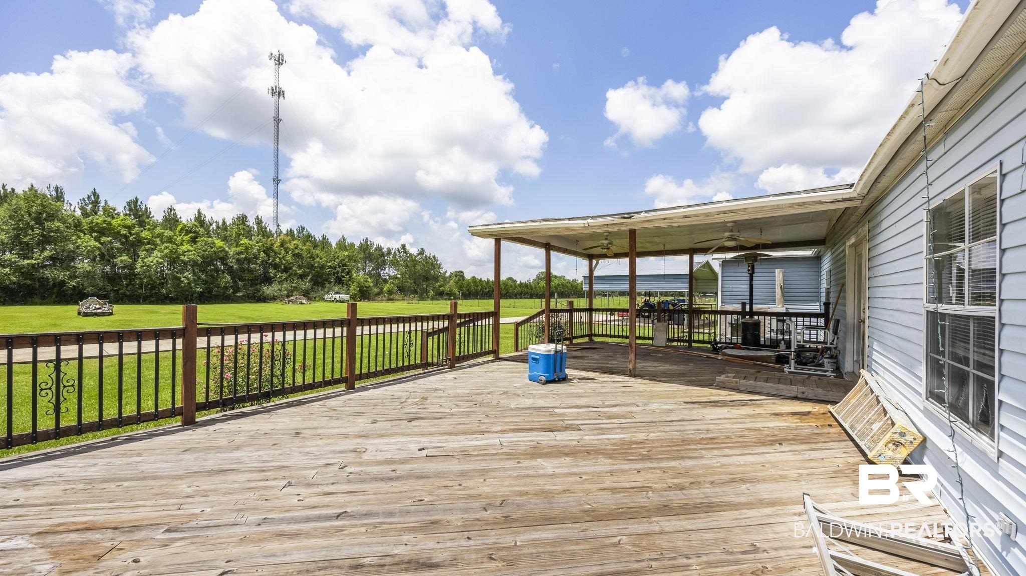 34985b Spring Road South, Unit B Stapleton, AL 36578 - Photo 25 of 31 Expansive outdoor wood deck with a covered patio area