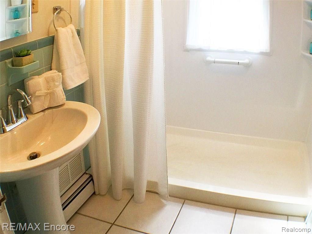 3180 Gerald Avenue Rochester, MI 48307 - Photo 7 of 12 Updated bath with walk in shower, ceramic tiled floor and new fixtures