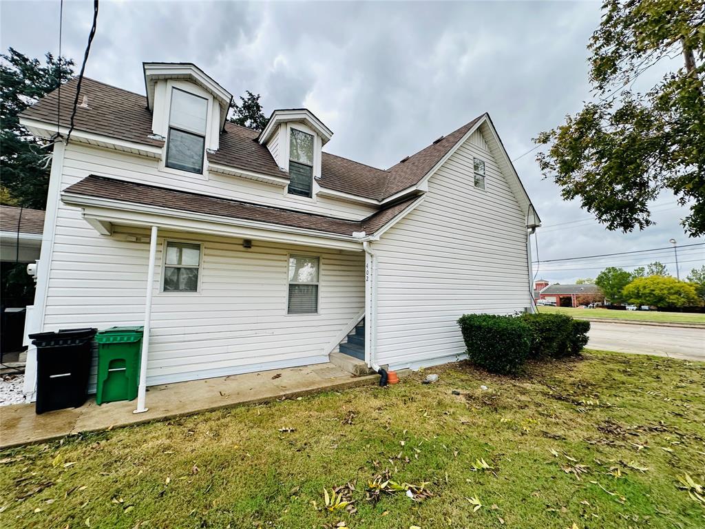a front view of a house with yard