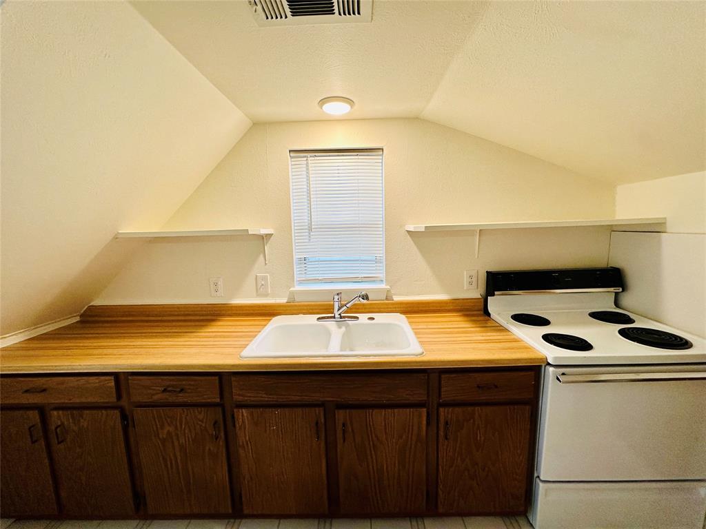 402 South Bryan-Belt Line Road Mesquite, TX 75149 - Photo 7 of 14 a bathroom with a sink and a mirror