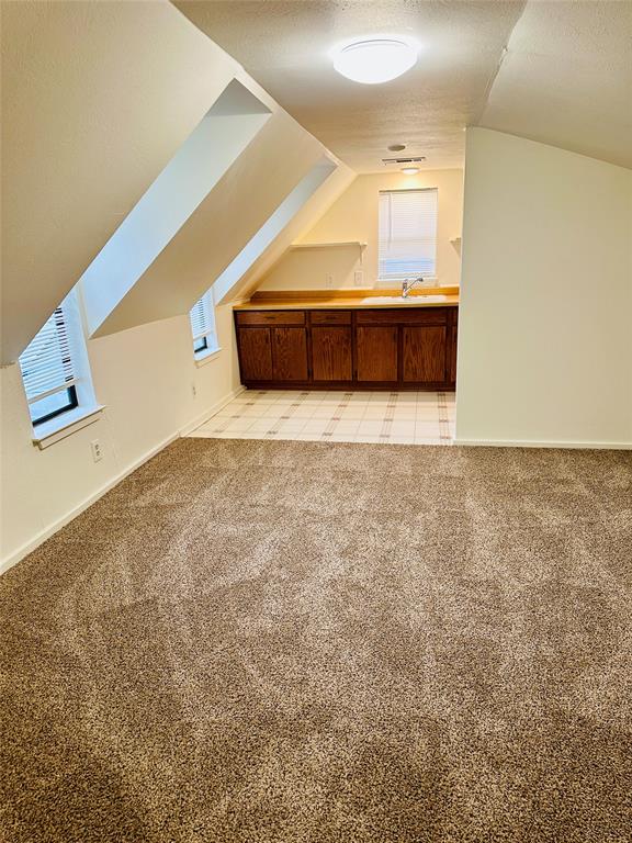 402 South Bryan-Belt Line Road Mesquite, TX 75149 - Photo 8 of 14 a room with a bed