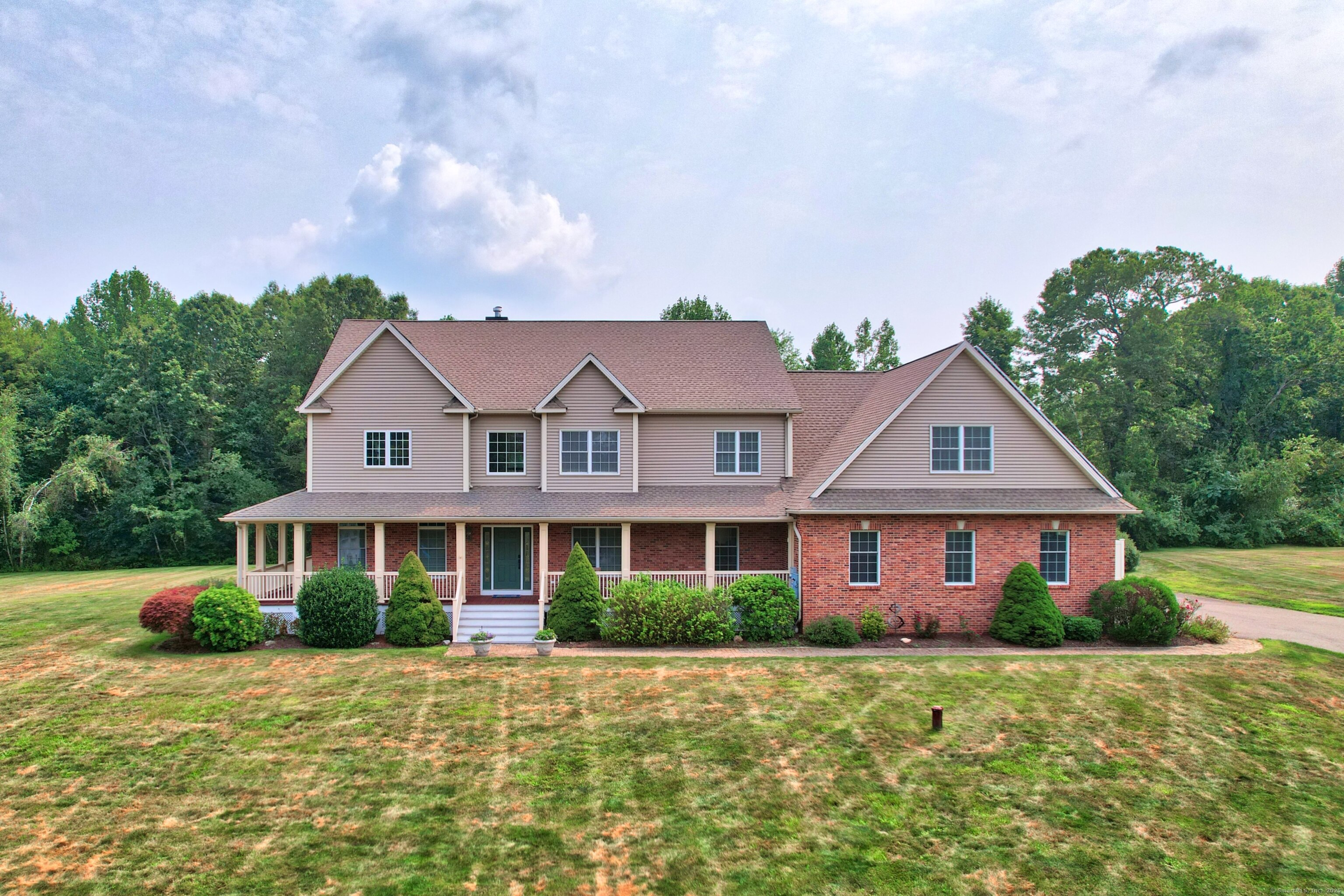 a front view of a house with a yard