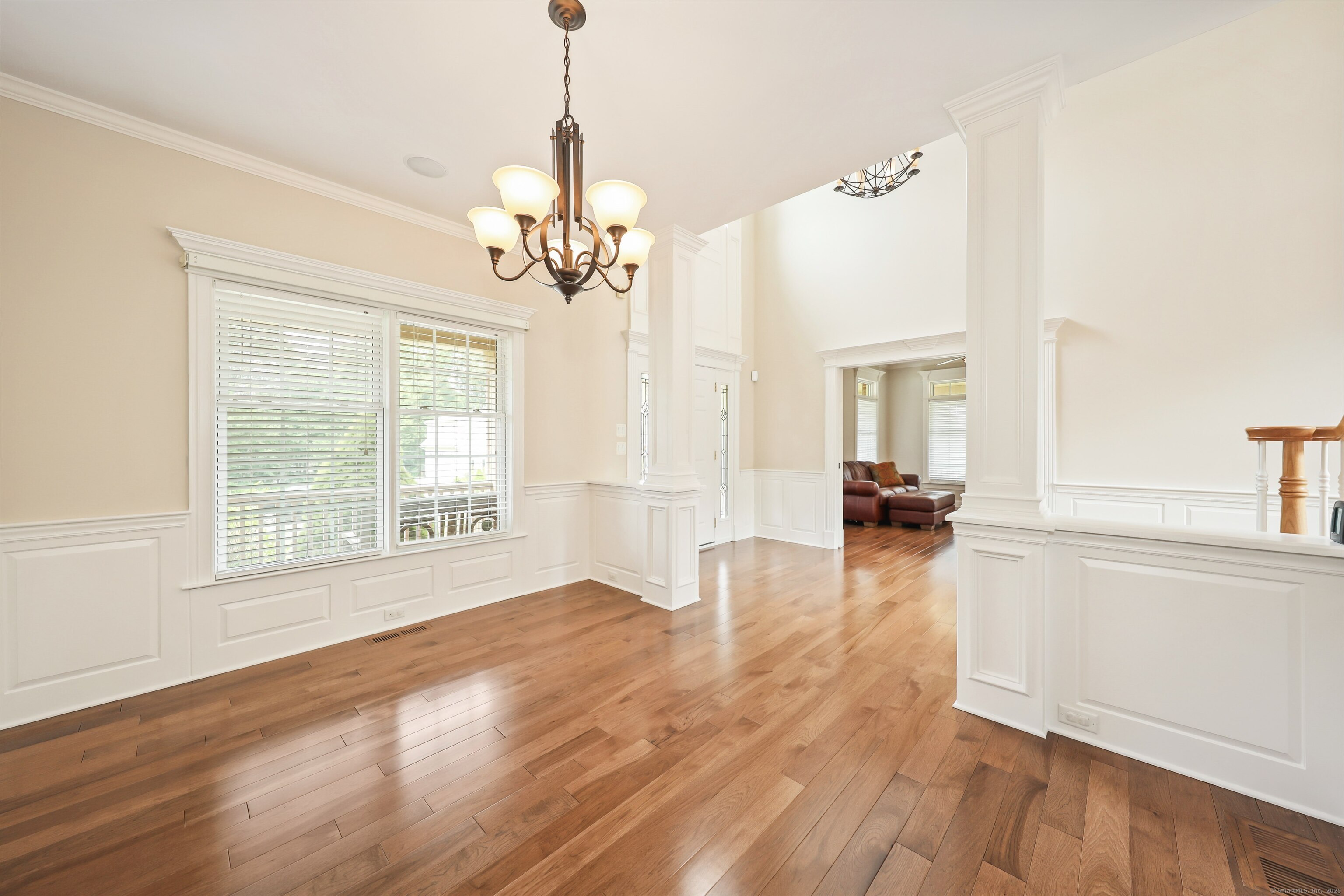 17 Hunters Ridge Wolcott, CT 06716 - Photo 11 of 40 a view of a livingroom with a chandelier wooden floor and a chandelier