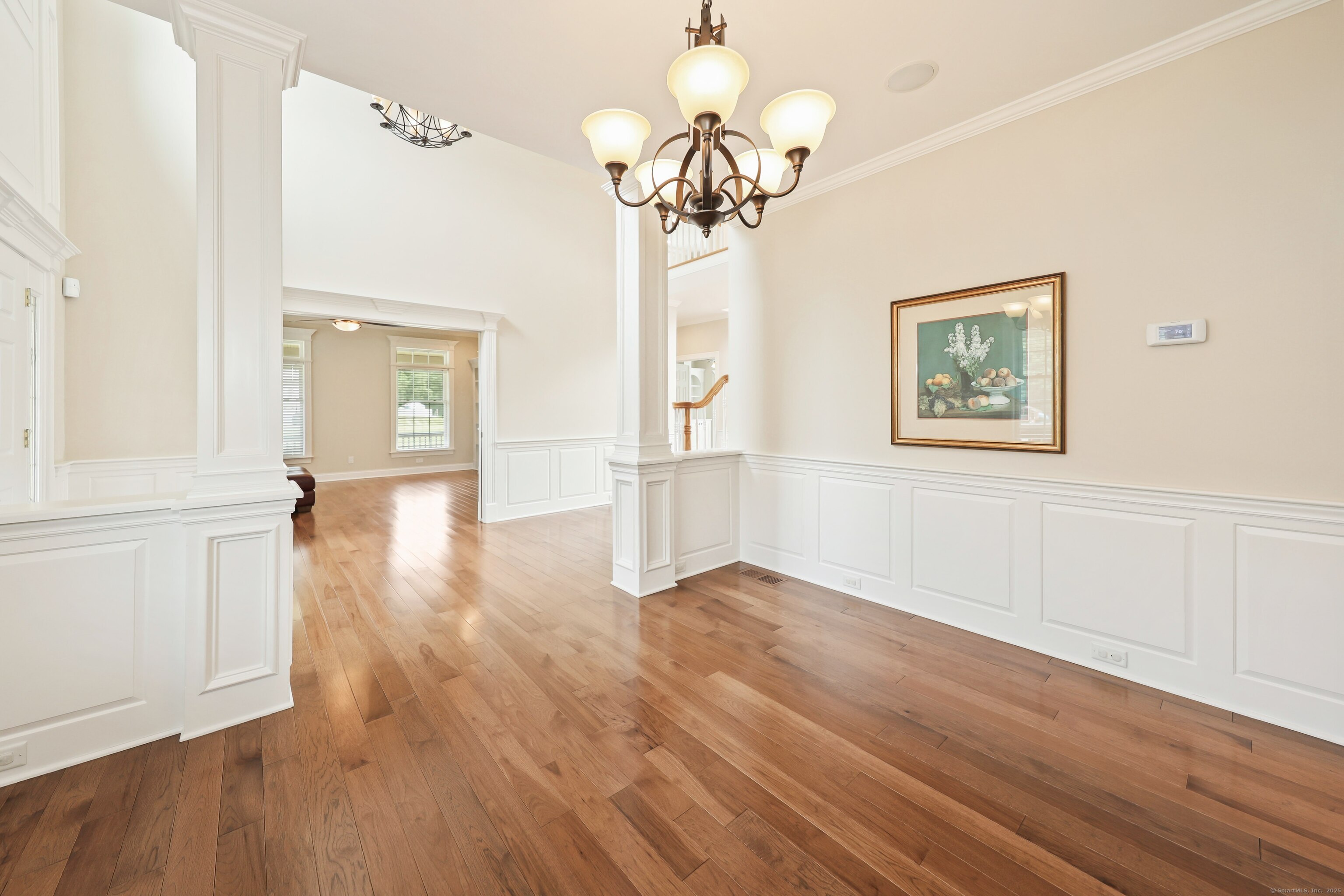 17 Hunters Ridge Wolcott, CT 06716 - Photo 12 of 40 an empty room with wooden floor cabinet and windows