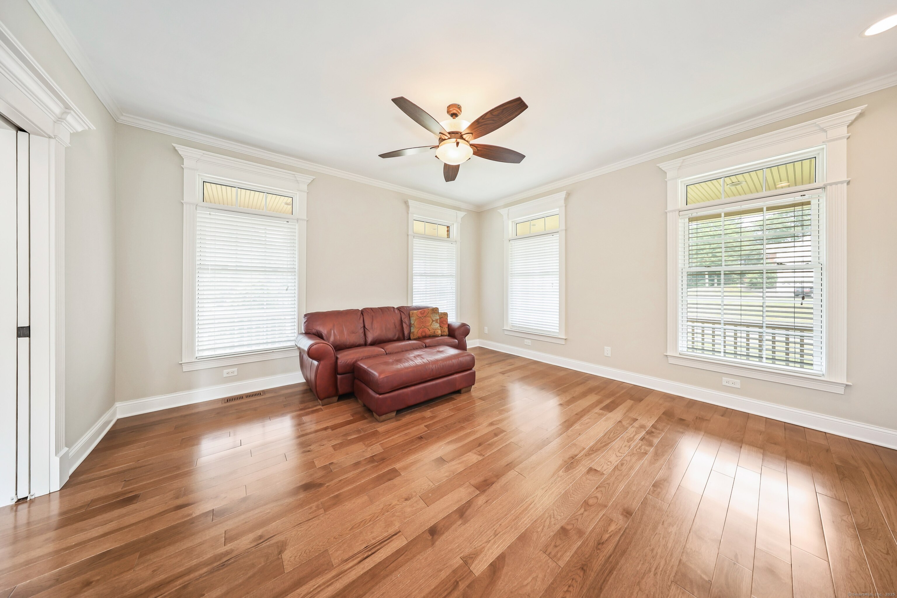 17 Hunters Ridge Wolcott, CT 06716 - Photo 15 of 40 a living room with wooden floor and a window