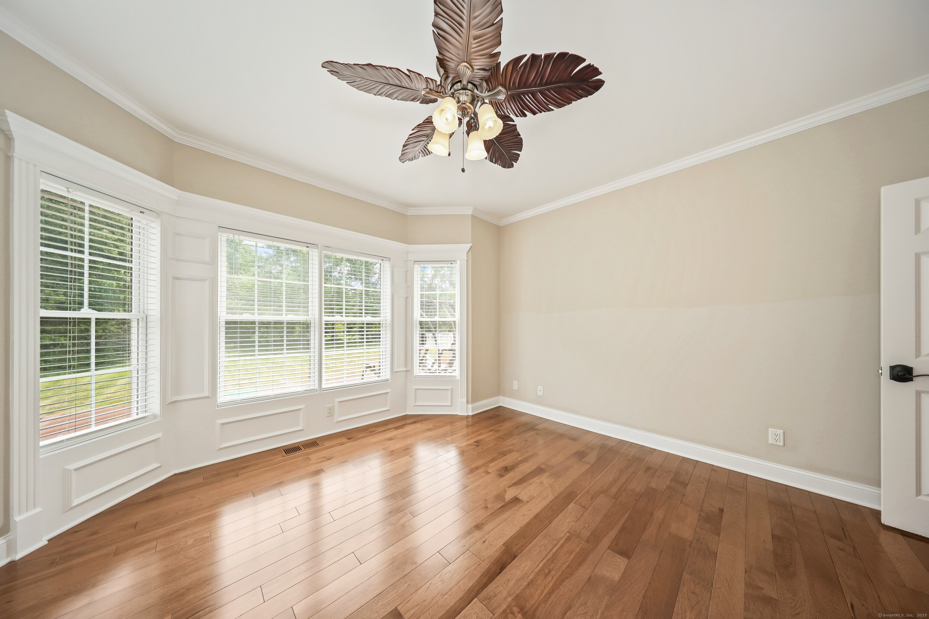 17 Hunters Ridge Wolcott, CT 06716 - Photo 18 of 40 a view of an empty room with wooden floor and a window