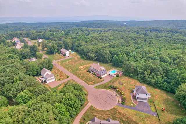 an aerial view of a house with a garden