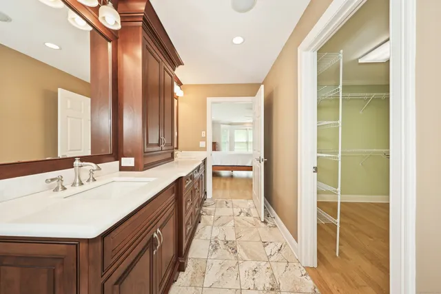 a bathroom with a double vanity sink and a mirror