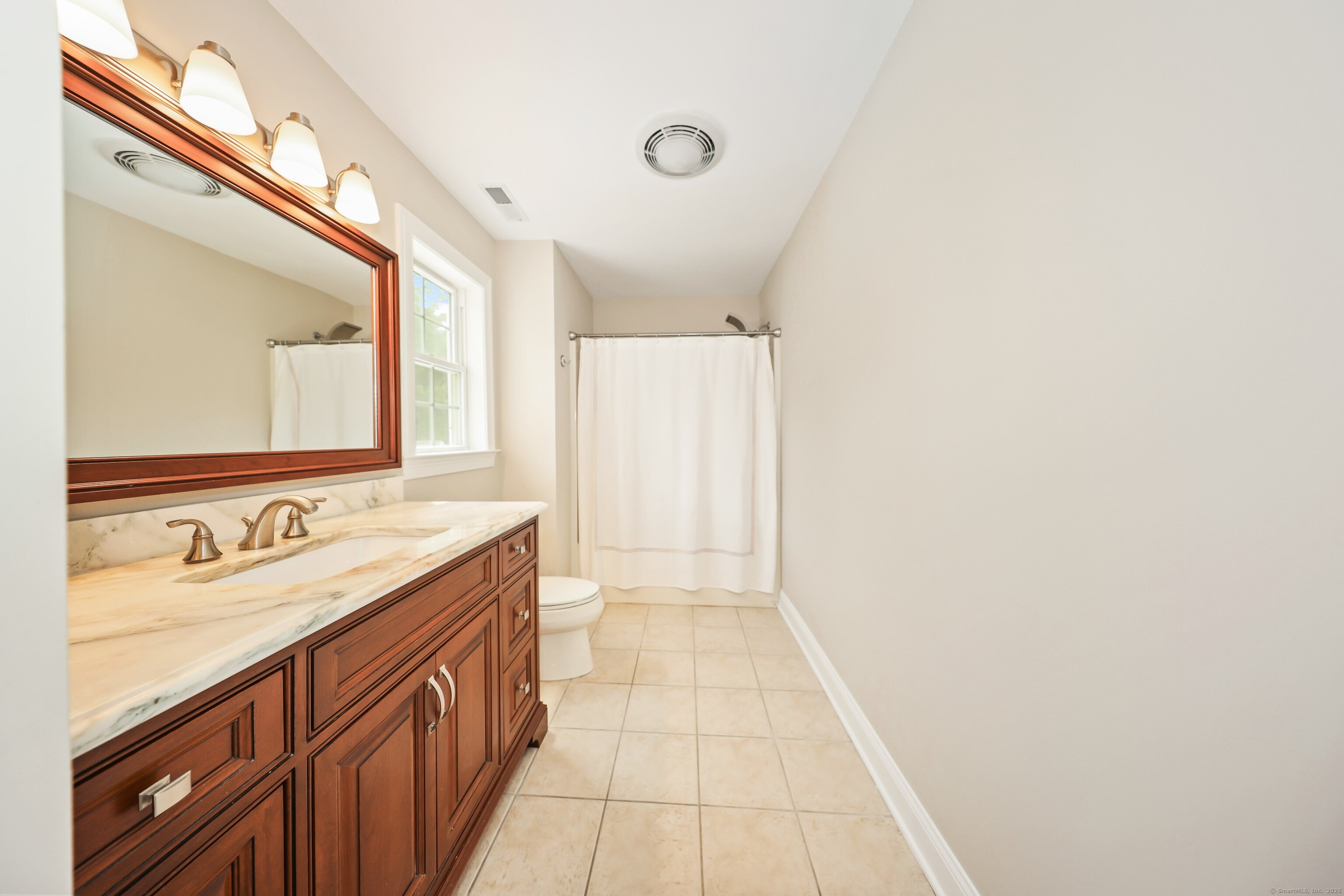 17 Hunters Ridge Wolcott, CT 06716 - Photo 27 of 40 a bathroom with a double vanity sink and a mirror