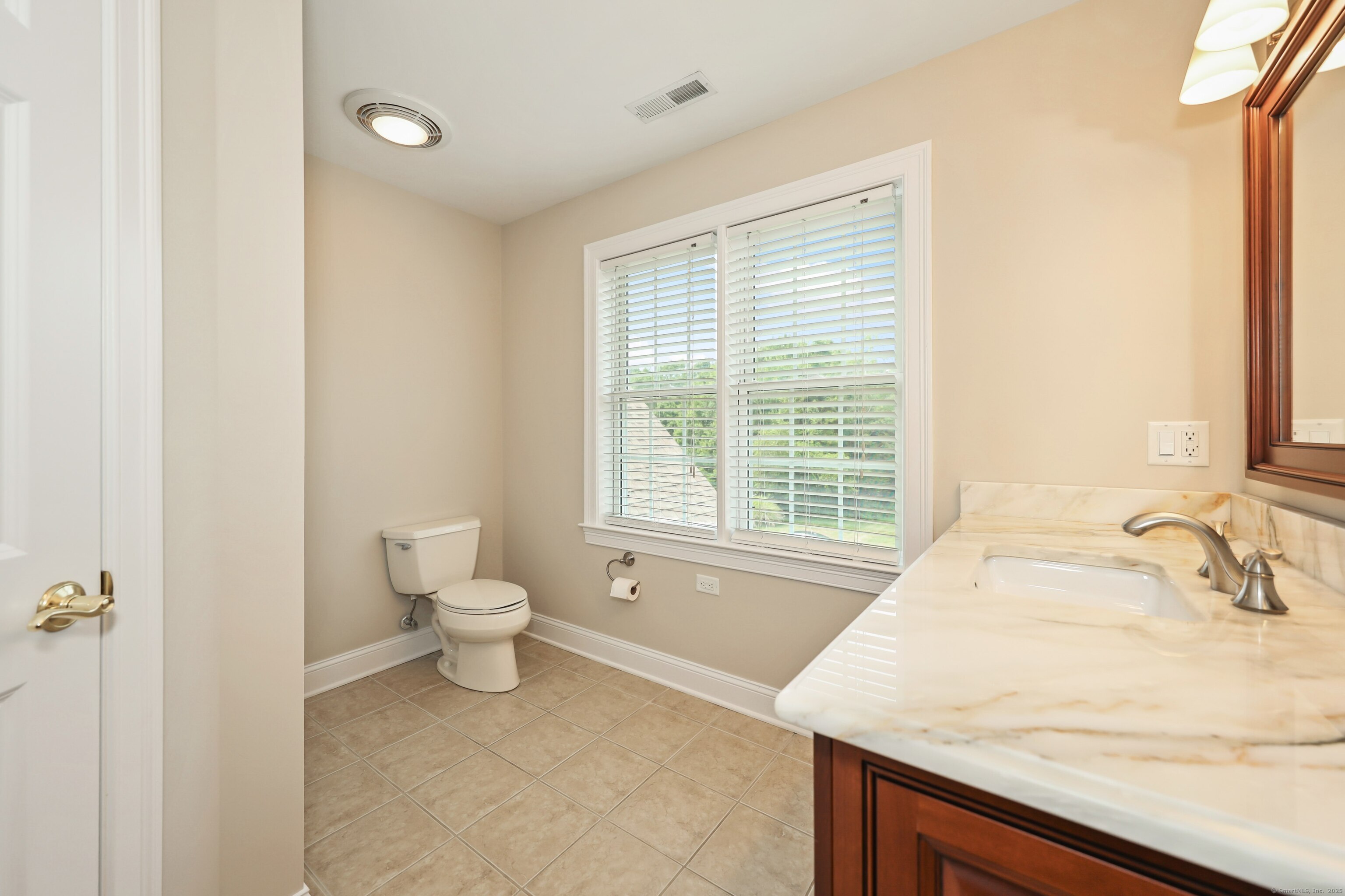 17 Hunters Ridge Wolcott, CT 06716 - Photo 30 of 40 a bathroom with a granite countertop sink a toilet and a bathtub