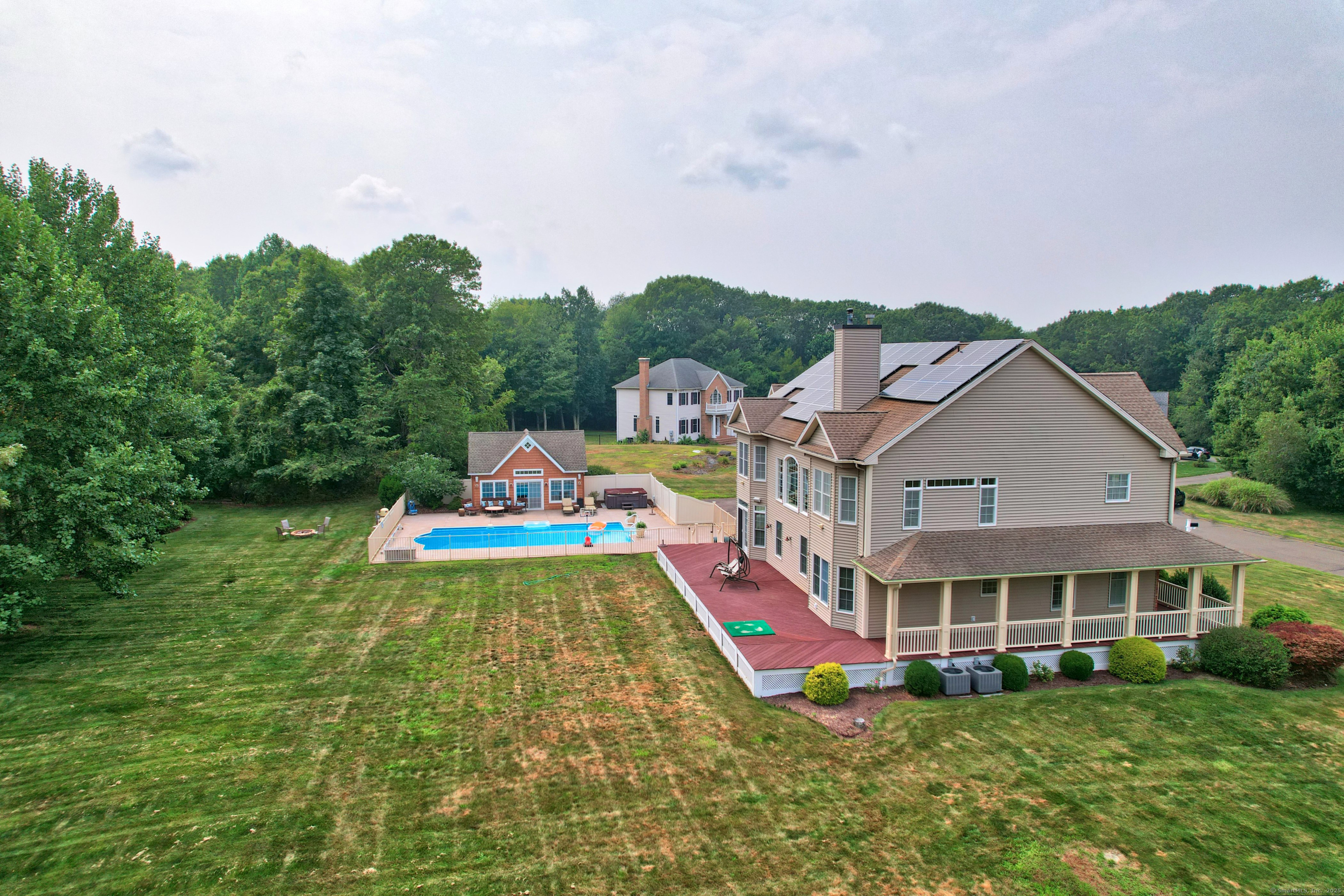 17 Hunters Ridge Wolcott, CT 06716 - Photo 39 of 40 a front view of house with yard and swimming pool