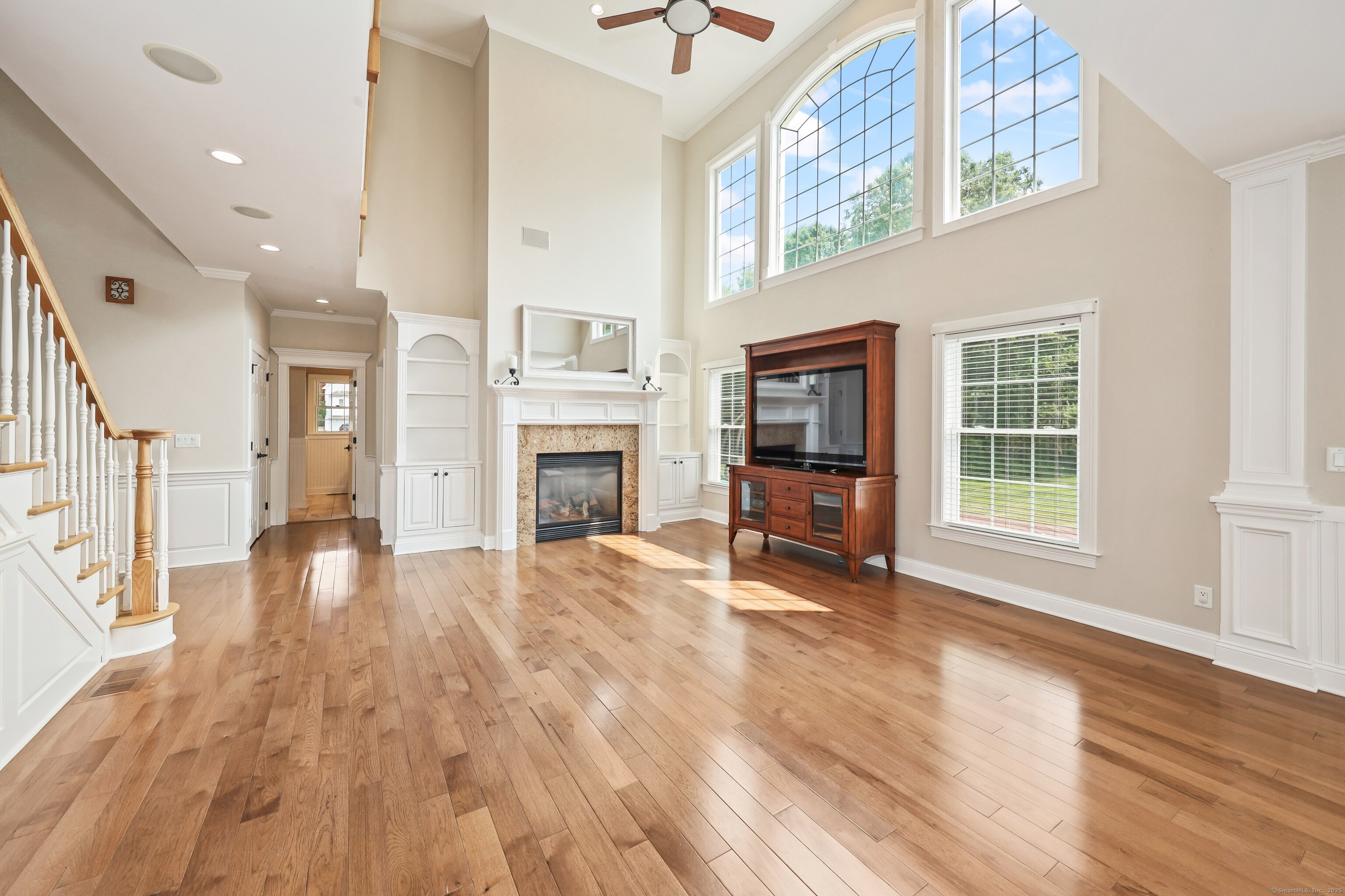 17 Hunters Ridge Wolcott, CT 06716 - Photo 10 of 40 a view of empty room with fireplace and wooden floor