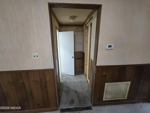 a view of a hallway with windows