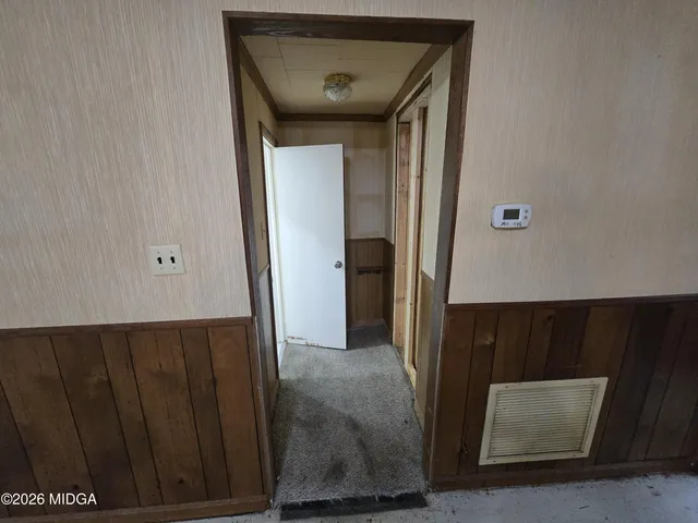 a view of a hallway with windows