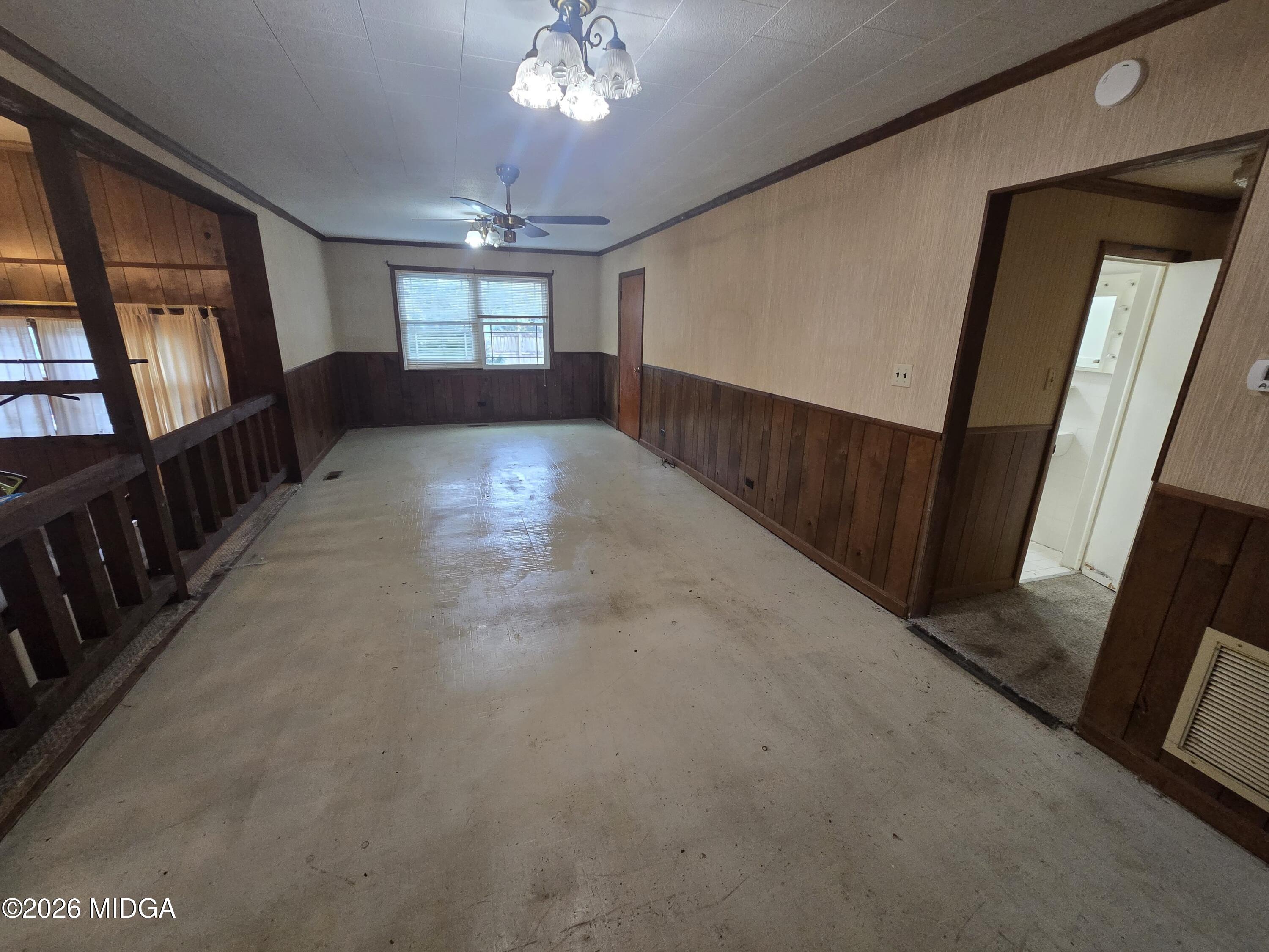 1070 Borum Street Unadilla, GA 31091 - Photo 16 of 18 a view of a hallway with windows