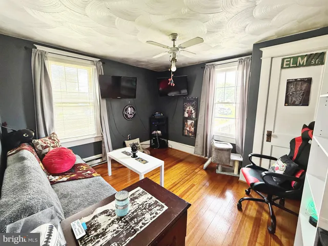 a view of a livingroom with furniture and window