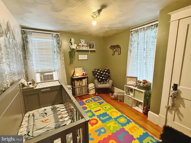 a bedroom with a bed and a table in it