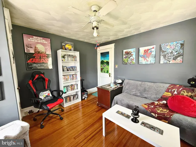 a living room with furniture a rug and a chandelier