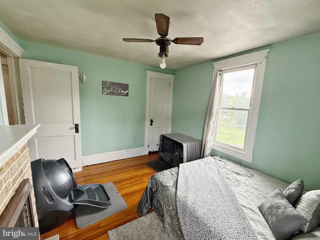 a bedroom with bed and a window