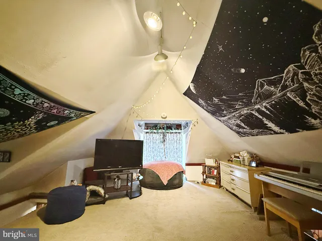 a room with furniture and a flat screen tv