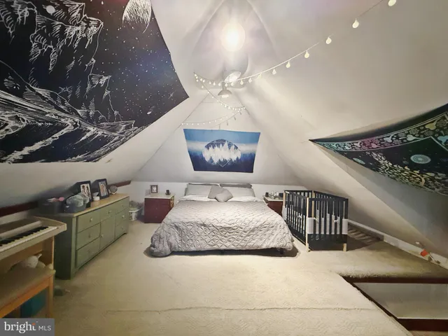 a bedroom with furniture and a chandelier