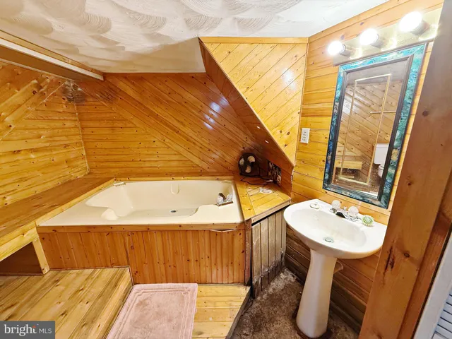 a bathroom with a sink and mirror