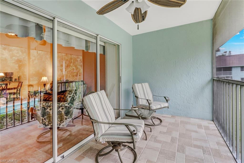 5675 Whitaker Road, Unit B202 Naples, FL 34112 - Photo 22 of 26 a view of a livingroom with chairs