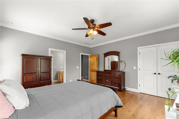a bathroom with a granite countertop sink a mirror and a shower