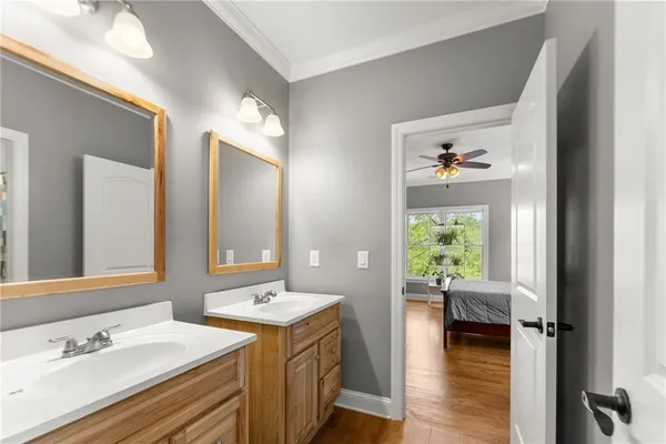 a bathroom with a toilet a sink and a mirror