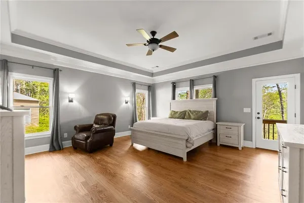 a living room with furniture window and wooden floor
