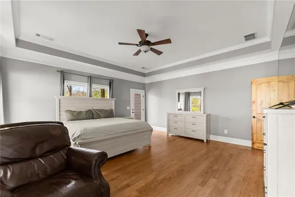 a living room with a bed furniture and a window