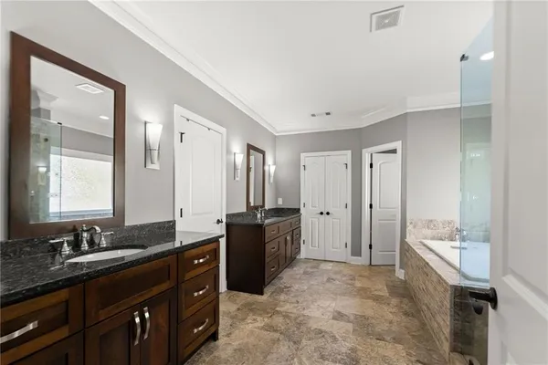 a room with a bed and cabinets