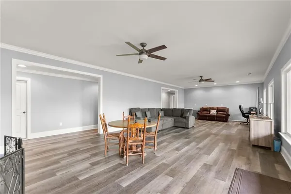 a view of a dining room with furniture window and wooden floor
