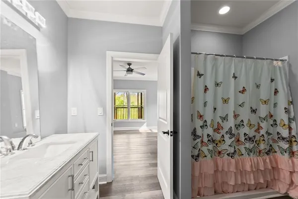 a view of house with a yard and garage