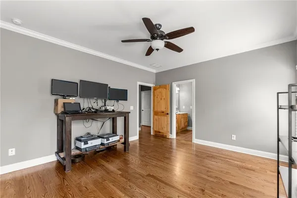 a view of a house with big yard and a large tree