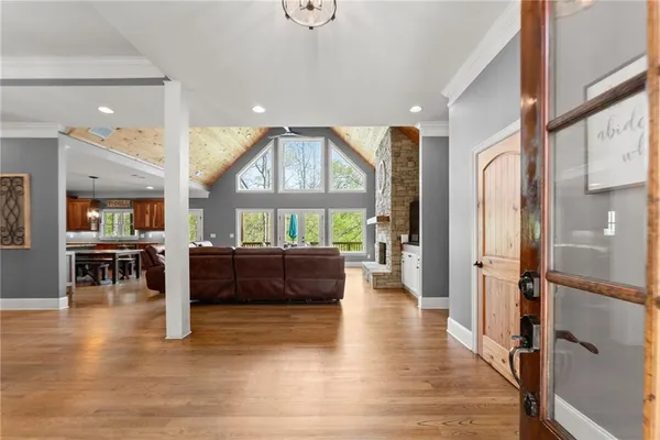 a living room with furniture and large windows