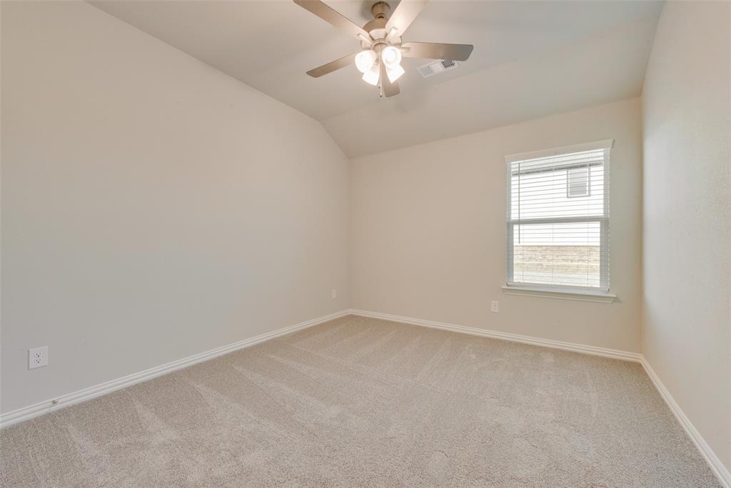 236 Sutter Mill Road Saginaw, TX 76131 - Photo 12 of 20 an empty room with a window and a fan