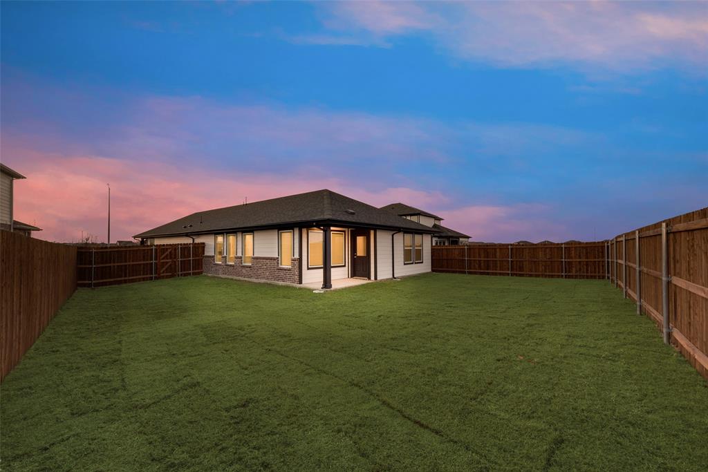 236 Sutter Mill Road Saginaw, TX 76131 - Photo 18 of 20 a view of a house with a yard