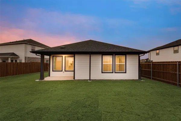 a view of a yard and a fence