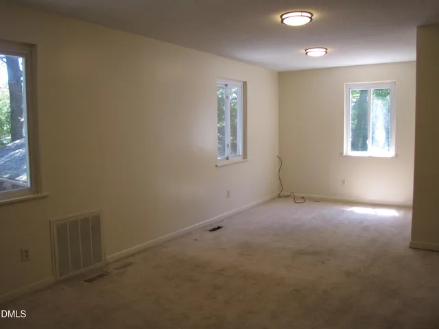 an empty room with windows