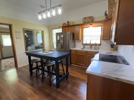 a kitchen with a table and chairs in it