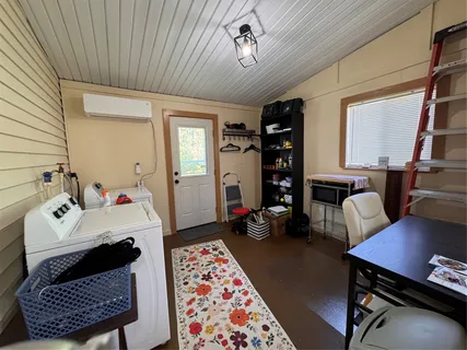 a bedroom with furniture and a window