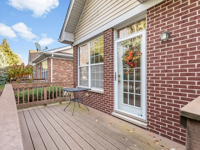 a view of a brick house with a large window